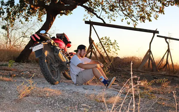 Costa Rica sunset with motorcycle and write Ellis Page